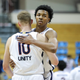 Virginia’s Sam Hauser (l.) and Trey Murphy III